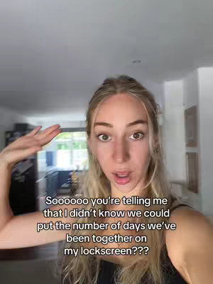 A young woman with long blond hair poses for a selfie, holding her hand up near her head. She is in an indoor setting with a bright light from a window. Text overlaying is displayed on the image.