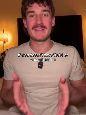 A man with a mustache is centered in the frame, wearing a white t-shirt. Text overlayed on the image suggests the video's topic. The background is dimly lit, hinting at an indoor setting.