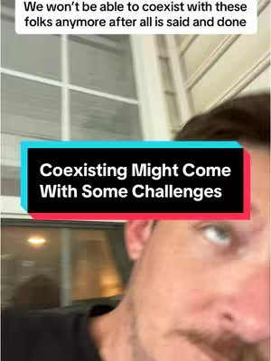 A selfie-style video cover image with a man's face dominating the lower half. The man has short hair and a beard, and he is looking towards the camera. Overlayed on the image is a text box in a vibrant teal color with a red bottom stripe. Contained within this box, bold white text reads, "Coexisting Might Come with Some Challenges". The background appears to be a window with some outdoor lighting visible behind the man.