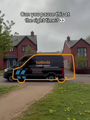 The image shows a black van on a residential street. The van, which has the Halfords logo, is outlined with a yellow border. The background includes houses and a cloudy sky, with a sidewalk and grass in the foreground. Text at the top reads: "Can you pause this at the right time?" with two eye emojis.