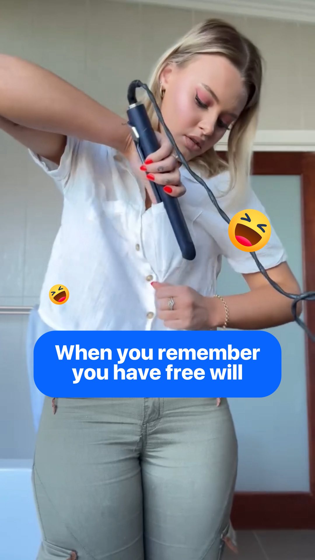 A woman is holding a hair straightener to her white shirt, as if ironing the wrinkles. A blue text box at the bottom reads, 'When you remember you have free will'. There are laughing emojis on the image.