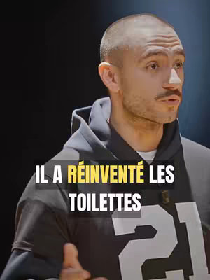 The cover image features a man in a black hoodie with the text overlay 'IL A RÉINVENTÉ LES TOILETTES' (He reinvented toilets). The man is bald, has a mustache, and is looking slightly to his right. The background is dark.
