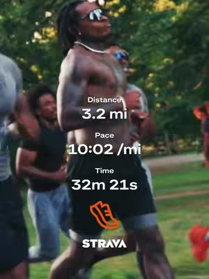 A group of runners are captured mid-stride outdoors. The primary focus is on the person in the center, who is shirtless with sunglasses.Overlayed on the image are running metrics such as distance, pace, and time.