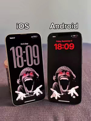The cover image shows two smartphones side by side, each displaying a lock screen live wallpaper featuring a distorted, screaming face. One phone is labeled 'iOS' and the other 'Android'. The phones are set against a neutral, uncluttered background.