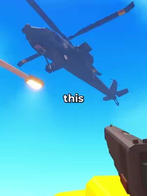 The cover image depicts a low-angle view of a Roblox game scene. A dark military-style helicopter flies across a bright blue sky, with a missile trail visible. A gun is in the foreground, viewed from the player's perspective, suggesting an action or defense-oriented gameplay scenario. The overall composition uses bright, primary colors and a simple, cartoonish aesthetic typical of Roblox.