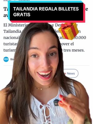 The cover image features a smiling woman centered in the frame, with a headline stating "Tailandia REGALA BILLETES GRATIS" overlaid at the top. The woman is looking directly at the viewer with a joyful expression. Her hair is long and brown, cascading over her shoulders. She wears a white top, and a small lapel microphone is visible on her chest. Behind her is a blurred background suggesting an indoor setting. A graphic of a wrapped gift is positioned to the right of the text.