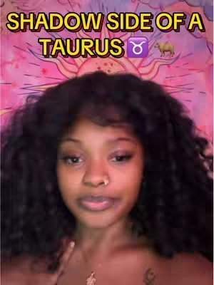 A woman with dark curly hair looks towards the camera with a serious expression. Text overlaid reads 'SHADOW SIDE OF A TAURUS' in a yellow stylized font with an illustrative Taurus glyph and a camel image on a pink, orange and yellow tie-dye background.