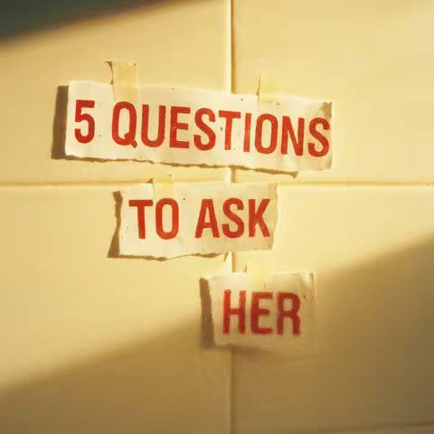 The image shows three rectangular pieces of paper attached to a yellowed wall with tape. Each paper has text in red. The top paper reads "5 QUESTIONS", the middle one says "TO ASK", and the bottom one says "HER". The composition is simple, with a focus on the text.