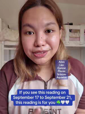 A woman with light brown hair, wearing a maroon sweater, is centered in a selfie-style shot. A vertical list of astrological signs (Aries, Leo, Cancer, Pisces, Scorpio, Aquarius) in a blue box is on the right side of her face. Beneath her, a text overlay in a blue box is present. The lighting seems bright and even, and the background lacks significant detail.