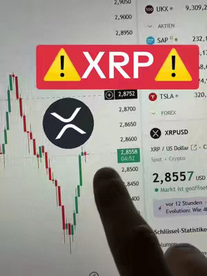 The image displays a stock chart with a focus on XRP, the cryptocurrency. A red warning icon with the word 'XRP' inside is placed on top of the chart. A finger touches the screen near the chart, and relevant stock data and numbers are visible.