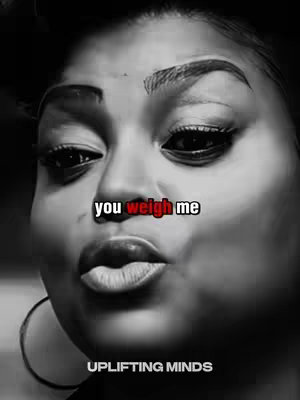A black and white image of a woman's face, emphasizing her lips and eyes. Text overlays read "you weigh me" in a two-tone style and "UPLIFTING MINDS" at the bottom.