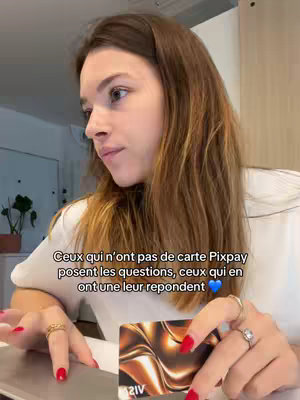 The cover image features a young woman holding a credit card. She is indoors, sitting at a desk with a laptop. The image has a casual, personal feel.