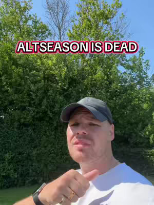 A man in a white shirt and a baseball cap is pointing his thumb up, with blurred green foliage and blue sky in the background. The text overlay 'ALTSEASON IS DEAD' is in vibrant white and red.