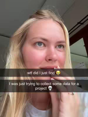 A close-up shot of a woman with blonde hair. She is looking upwards with a surprised expression. Text overlays on the screen.