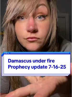 A woman with fair skin and blonde hair looks at the camera with a neutral expression. A blue and white text box across the bottom of the image reads, "Damascus under fire Prophecy update 7-16-25".