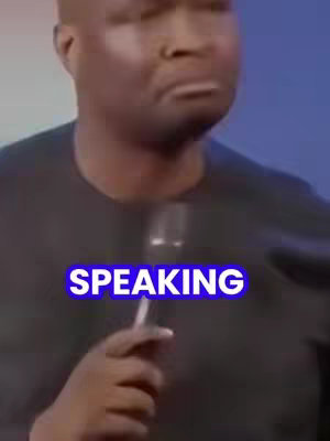 The cover image is a medium shot of a man speaking, centered in the frame. He is wearing a dark shirt, and a microphone is in front of him. The background is blurred, with shades of blue. Overlaid on the image in bold, white text with a blue outline is the word "SPEAKING". The man's expression appears serious or intent as he addresses the audience.