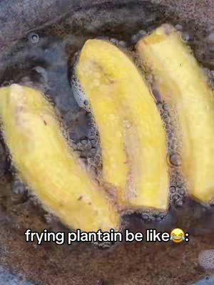 A close-up shot shows three pieces of frying, golden-yellow plantain submerged in hot oil, which is bubbling. The plantains are positioned horizontally across the frame. The bottom of the frame contains a text overlay.