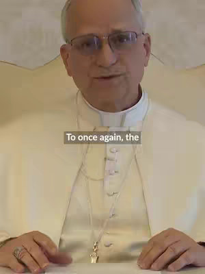 The cover image features a man wearing glasses, dressed in traditional religious attire. The backdrop appears to be a plain wall behind him. A text overlay is at the bottom of the frame.