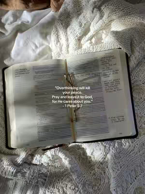 The cover image features an open Bible on a white, textured blanket. The Bible is marked with notes and a bookmark. Overlay text provides a quote from 1 Peter 5:7.