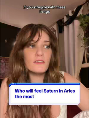 A woman with brown hair looks slightly up and to the right, with a thoughtful expression. The background appears to be a room, possibly a bedroom. A text overlay in a blue box reads, 'Who will feel Saturn in Aries the most'. Above the woman, text reads: 'if you struggle with these things'.