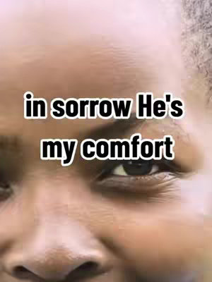 A close-up shot of a person's face, focusing on the eye and the surrounding skin. The skin is light-colored and has a slightly uneven texture. The text overlay 'in sorrow He's my comfort' is placed over the face.