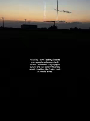 The cover image is divided into two sections: a predominantly black lower half and an upper half depicting a dusk scene. In the upper portion, a field of green leads to a distant football field with goalposts silhouetted against a gradient sky of orange, yellow, and muted purple hues. Streetlights are visible along the horizon. Overlayed on the black section is white text.