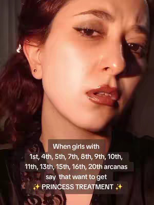 A close-up shot of a woman with fair skin and dark hair, looking up and to the side with a slight squint. She has full, shiny lips and dark eyeliner. Overlaid on the image is a rectangular box with white text that reads: "When girls with 1st, 4th, 5th, 7th, 8th, 9th, 10th, 11th, 13th, 15th, 16th, 20th arcanas say that want to get ✨ PRINCESS TREATMENT ✨."