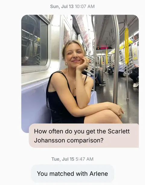 A smiling woman with blonde hair, wearing a black top, sits on a subway seat. The subway car has white walls, yellow bars, and windows. The image includes text bubbles that appear to be text messages.