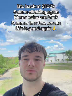 A selfie style video featuring a young man with short brown hair against a backdrop of a sunny sky and a green landscape. Overlayed text describes positive financial trends.