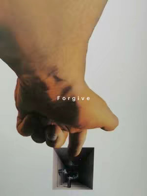 A grayscale image showing a hand pressing a finger onto what seems to be a small, dark, rectangular pit. The word "Forgive" is superimposed on the hand.