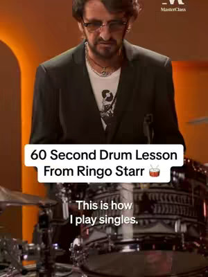 The image shows a man, Ringo Starr, in front of a drum set. Text overlays indicate a drum lesson. The lighting is warm, giving the image a polished feel.