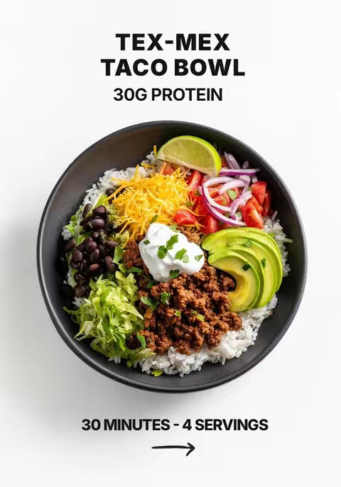 A top-down shot of a black bowl filled with a Tex-Mex style taco bowl, set against a clean white background. The bowl is filled with a base of white rice, topped with ingredients arranged in sections: black beans, shredded lettuce, grated cheddar cheese, diced red onions, sliced tomatoes, avocado slices, a lime wedge, and a dollop of sour cream. A large section is covered with seasoned ground beef, suggesting this is the main protein. The top text states “TEX-MEX TACO BOWL,” immediately followed by “30G PROTEIN.” Below the bowl is another line of text informing viewers that it’s ready in 30 minutes and serves 4, the food looks fresh and appetizing, and the image has a clean and modern look.