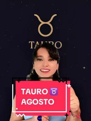 A woman with dark hair and a smile holds a sign with the words 'Tauro Agosto' in front of a backdrop of a starry night sky and zodiac symbols.