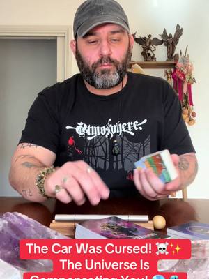 A man with a beard and a baseball cap is seated at a table, apparently getting ready to give a tarot reading. Text overlayed on the bottom of the screen, a stylized title in a red box, conveys the video's theme.
