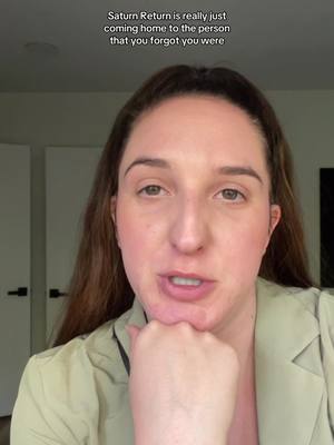 The cover image shows a close-up of a woman's face, facing the camera directly. She has dark hair, fair skin, and is wearing a light-colored blazer. Text is overlaid at the top, and the image appears to be lit with soft, natural light.