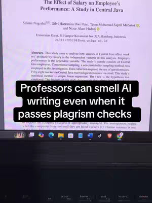 The cover image shows a computer screen displaying a research paper about employee performance in Central Java. A black rectangle overlay with white text stating "Professors can smell AI writing even when it passes plagiarism checks" is prominently positioned over the lower half of the screen. The paper's title and abstract are visible.