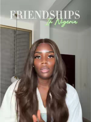 A woman with brown hair looks directly at the camera. Text overlays state "Friendships In Nigeria". The background shows a room interior.