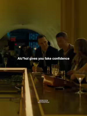 A movie still showing a bar scene. The lighting is dim, and a few people are sitting and standing at the bar. The text overlay reads, "Alc*hol gives you fake confidence." The Alpha Motivation logo is at the bottom.