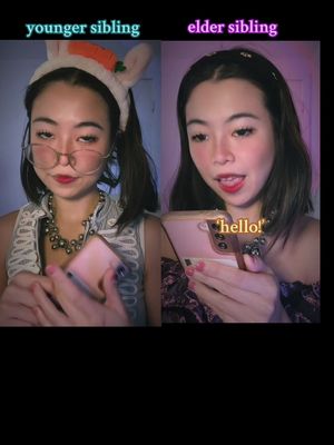 The cover photo splits the frame. On the left, a woman, styled as a younger sibling, wears a bunny ear headband and glasses, looking at her phone. On the right, the same woman, representing an older sibling, poses with a phone, with text reading 'hello!' appearing on the screen. The image features a mix of purples and pinks, and a dark background.
