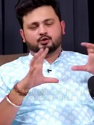 A man is gesturing with his hands while speaking. Text is overlaid on the bottom of the image.