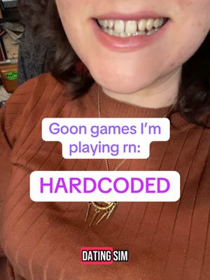 A close-up shot of a person's lower face, showcasing their smiling mouth and teeth. White text boxes with pink outlines are overlaid, containing text about gaming interests.