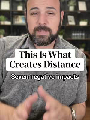 A medium shot features a man with a beard and a serious facial expression, directly facing the camera. He's wearing a gray shirt. A white banner with black text is overlaid on the image, displaying the words "This Is What Creates Distance" and "Seven negative impacts". The background is blurred, suggesting a location with bookshelves in the distance.
