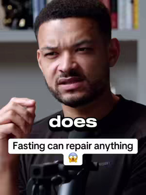 A man with a beard and short dark hair is looking at the camera with a quizzical expression. Text overlays read "does" and "Fasting can repair anything" with an emoji of a face with wide eyes and the mouth open in a surprised expression.