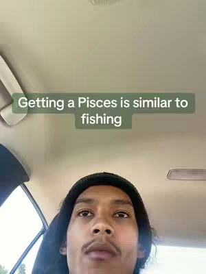 The cover image shows a selfie-style shot with the creator's face as the focal point. The creator, a person with dark hair and a beanie, is positioned in the bottom half of the frame, looking at the camera. Above the creator's head is a text overlay, set against a green background. The background is a muted, neutral tone, suggesting the interior of a vehicle.