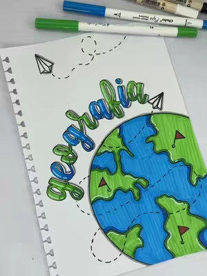 A notebook page with the word 'Geografia' in colorful lettering above a half-globe illustration with continents in green and oceans in blue. Dotted lines trace paths to paper airplanes. Markers are in the background.