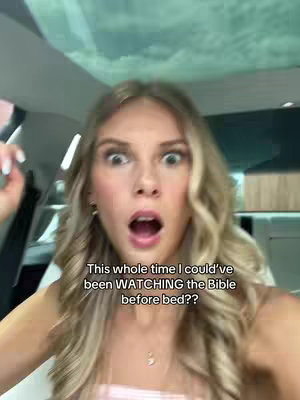 A young woman with long blonde hair looks at the camera with a surprised expression, her mouth open in an "O". Text overlay is at the bottom.