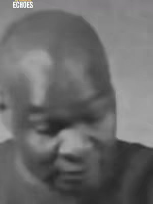 The cover image shows a blurred, black and white close-up of a man's face. The man has a dark complexion and a visible hairline. The image is soft and indistinct, with the focus mainly on the center of the face.