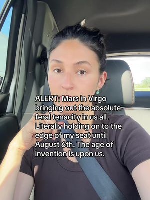 A woman is in a car, looking toward the camera with the text overlayed on the image. The text is an alert concerning astrology and upcoming celestial events.