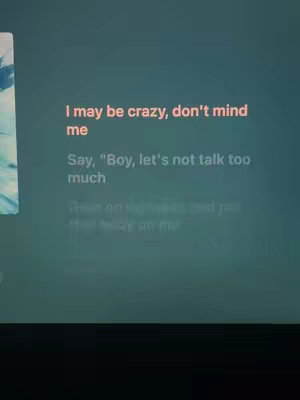 The image is a screen capture with text overlayed. It appears to be lyrics of a song or quote over a dark green or teal background. The text itself is center-aligned and presented in a readable font.