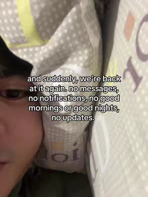 The cover image shows a person, likely lying in bed, with a close-up framing. The person is mostly obscured by bedding, which is a light color with small, darker-colored polka dots. The text overlayed reads: 'and suddenly, we're back at it again. no messages, no notifications, no good mornings or good nights, no updates.'